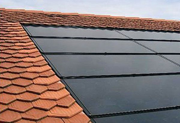 Low profile flush-mounted solar panels installed close to the roof surface, minimal visible racking