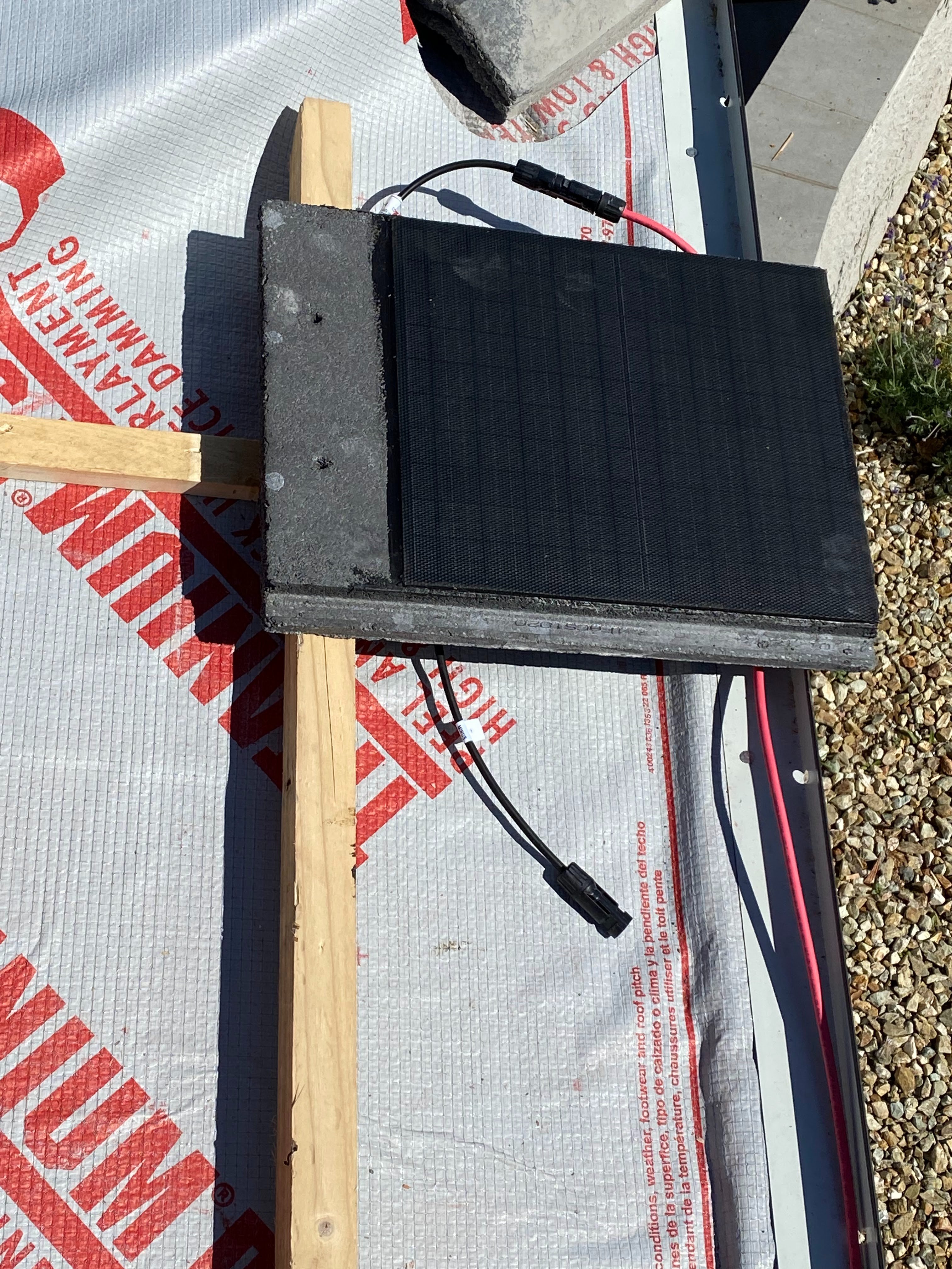 Close up of a solar tile's cell texture and integrated wiring at the tile edge